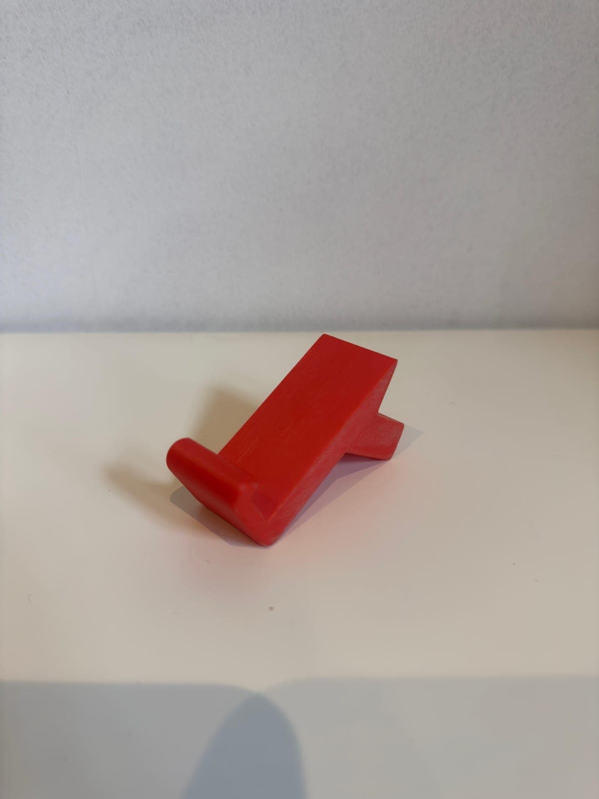 Custom phone stand, 3D printed in red PLA