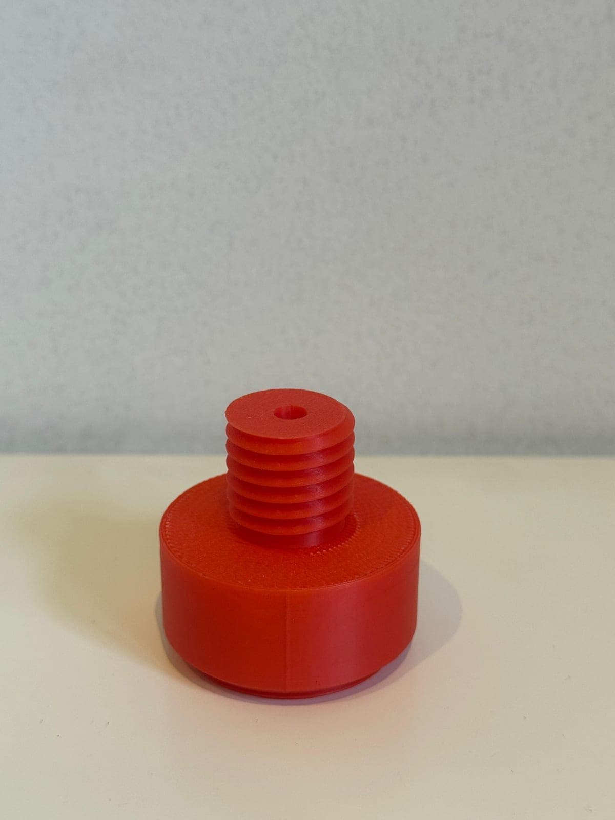 Custom threaded pipe adapter, 3D printed in red PLA